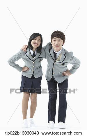Stock Image - a boy and a girl in school uniforms. Fotosearch