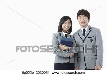 Stock Image - a boy and a girl in school uniforms. Fotosearch