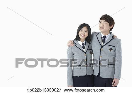 Stock Photo - a boy and a girl in school uniforms. Fotosearch