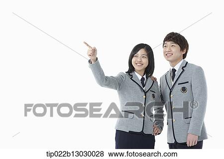 Stock Photo - a boy and a girl in school uniforms. Fotosearch