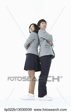 Stock Photo - a boy and a girl in school uniforms. Fotosearch