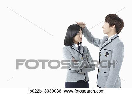 a boy and a girl in school uniforms View Large Photo Image Stock Photograph - a boy and a girl in school uniforms. Fotosearch
