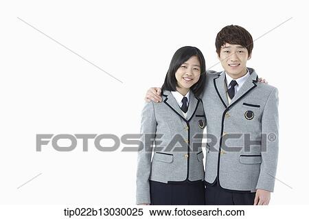 Stock Photography - a boy and a girl in school uniforms. Fotosearch