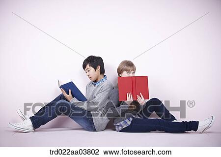 a boy and a girl reading books View Large Photo Image Stock Image - a boy and a girl reading books. Fotosearch