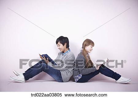 a boy and a girl reading books View Large Photo Image Stock Photography - a boy and a girl reading books. Fotosearch
