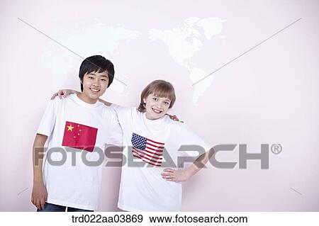 Stock Photo - a boy and a girl with Chinese and American flags on their t-shirts. Fotosearch