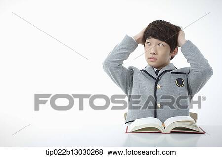 a boy doing homework View Large Photo Image Stock Photo - a boy doing homework. Fotosearch