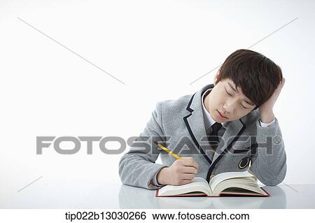 a boy doing homework View Large Photo Image Stock Photograph - a boy doing homework. Fotosearch