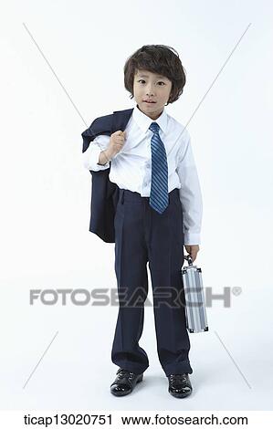 a boy dressed up as a business man View Large Photo Image Stock Image - a boy dressed up as a business man. Fotosearch