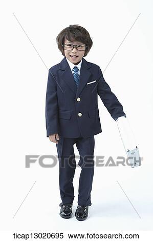 Stock Photography - a boy dressed up as a business man. Fotosearch