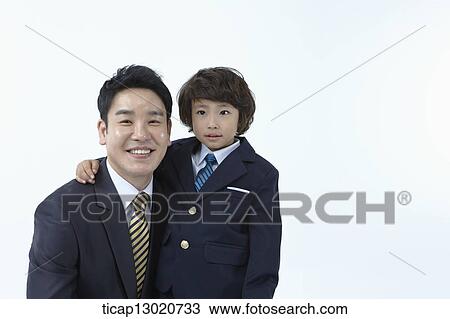 a boy dressed up as a business man with his father View Large Photo Image Stock Image - a boy dressed up as a business man with his father. Fotosearch