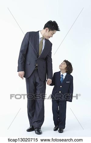 a boy dressed up as a business man with his father View Large Photo Image Stock Photography - a boy dressed up as a business man with his father. Fotosearch