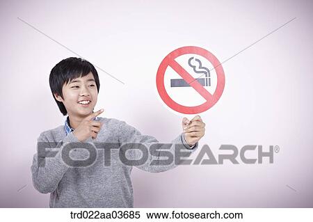 a boy holding boards saying no smoking View Large Photo Image Stock Photography - a boy holding boards saying no smoking. Fotosearch
