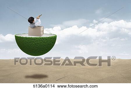 a boy in a box on floating land View Large Photo Image Picture - a boy in a box on floating land. Fotosearch