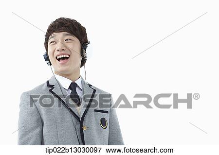 a boy in a school uniform wearing a head set View Large Photo Image Stock Photo - a boy in a school uniform wearing a head set. Fotosearch
