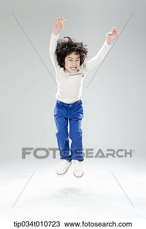 a boy jumping in the air View Large Photo Image Stock Image - a boy jumping in the air. Fotosearch