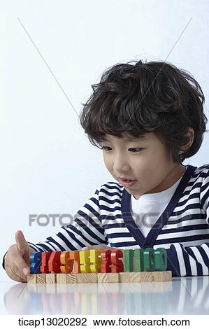 a boy playing with toys View Large Photo Image Stock Image - a boy playing with toys. Fotosearch
