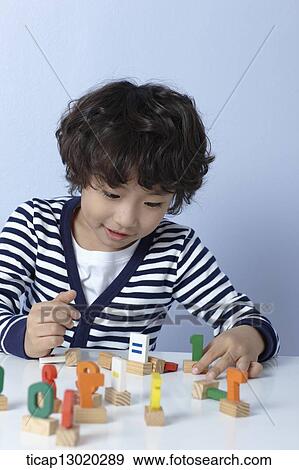 a boy playing with toys View Large Photo Image Stock Photo - a boy playing with toys. Fotosearch