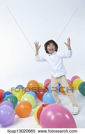 Stock Photography - a boy with a lot of balloons. Fotosearch