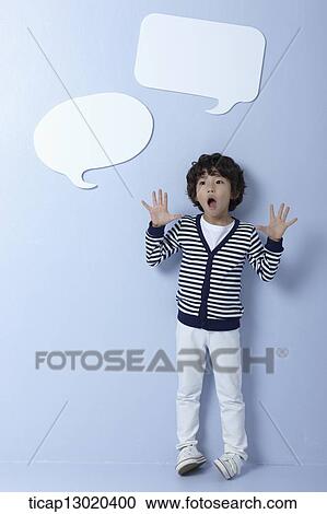 Stock Image - a boy with empty speech bubbles. Fotosearch