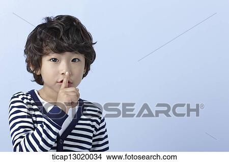 Picture - a boy with striped shirt posing. Fotosearch