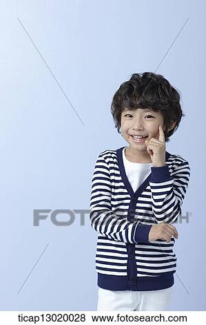 a boy with striped shirt thinking View Large Photo Image Stock Photo - a boy with striped shirt thinking. Fotosearch