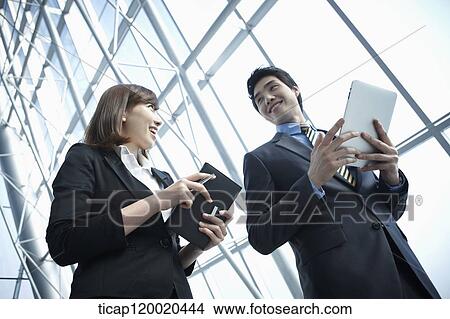 a business man and a business woman View Large Photo Image Picture - a business man and a business woman. Fotosearch