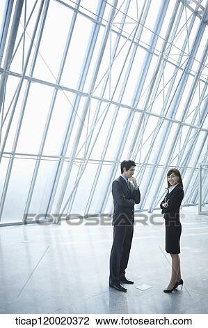 Stock Image - a business man and a business woman. Fotosearch