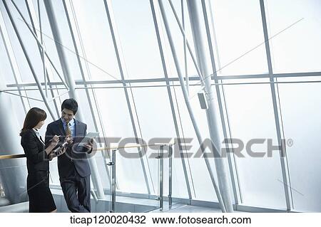 Stock Image - a business man and a business woman. Fotosearch