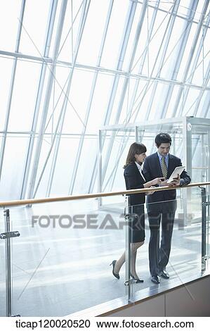 a business man and a business woman View Large Photo Image Stock Image - a business man and a business woman. Fotosearch
