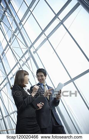 Stock Photograph - a business man and a business woman. Fotosearch