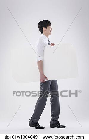 a business man carrying a blank paper View Large Photo Image Stock Image - a business man carrying a blank paper. Fotosearch