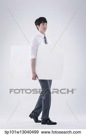 a business man carrying a blank paper View Large Photo Image Stock Photo - a business man carrying a blank paper. Fotosearch
