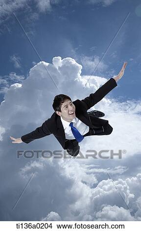 Picture - a business man flying. Fotosearch