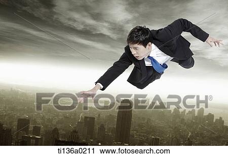 Stock Image - a business man flying. Fotosearch