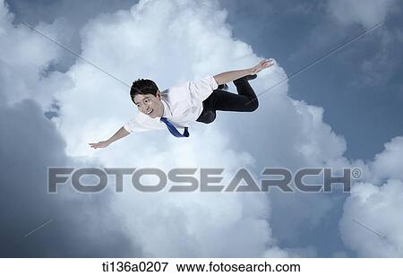 a business man flying View Large Photo Image Stock Photo - a business man flying. Fotosearch