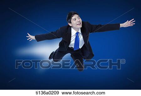 a business man flying View Large Photo Image Stock Photo - a business man flying. Fotosearch