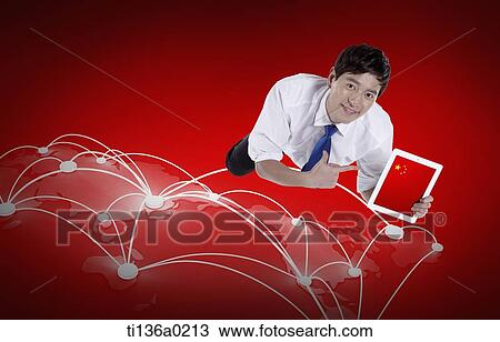 Stock Image - a business man flying with a tablet. Fotosearch
