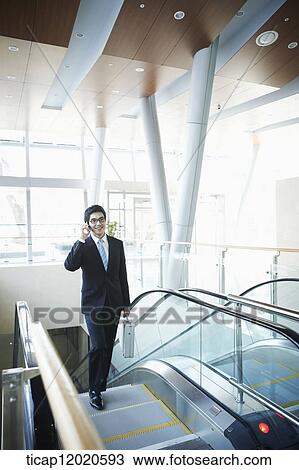 a business man going up the stairs View Large Photo Image Stock Image - a business man going up the stairs. Fotosearch