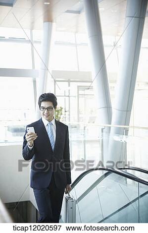 a business man going up the stairs View Large Photo Image Stock Photo - a business man going up the stairs. Fotosearch