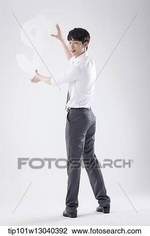 a business man holding a dollar sign View Large Photo Image Stock Image - a business man holding a dollar sign. Fotosearch