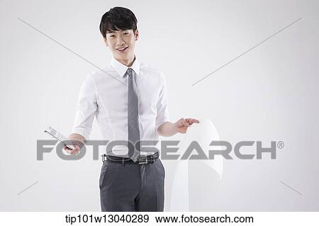 a business man holding a paper roll View Large Photo Image Stock Photo - a business man holding a paper roll. Fotosearch