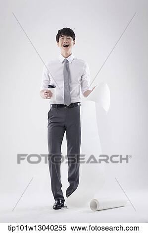 a business man holding a paper roll View Large Photo Image Stock Photography - a business man holding a paper roll. Fotosearch