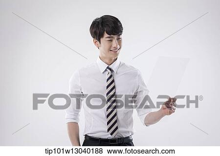 a business man holding a transparency sheet View Large Photo Image Stock Photo - a business man holding a transparency sheet. Fotosearch
