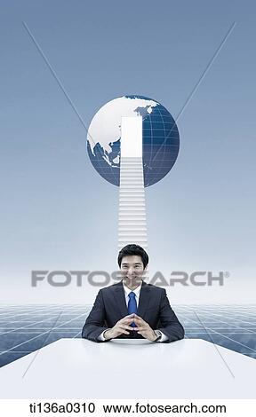 a business man in front of a globe View Large Photo Image Stock Image - a business man in front of a globe. Fotosearch