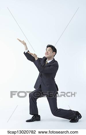 a business man kneeling View Large Photo Image Stock Image - a business man kneeling. Fotosearch