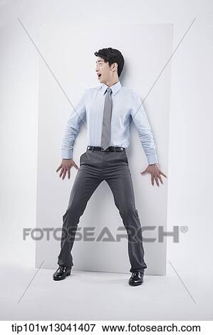 Stock Photo - a business man leaning at a block. Fotosearch