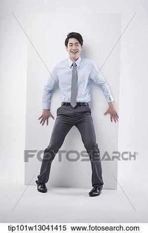 Stock Photography - a business man leaning at a block. Fotosearch