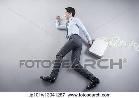 Stock Photo - a business man lying on the floor in a walking pose. Fotosearch