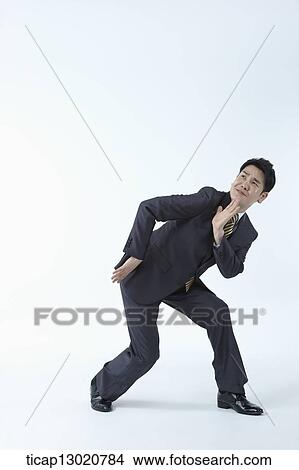 Picture - a business man posing. Fotosearch